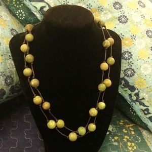 Turquoise bead and silver clasp double strand necklace.